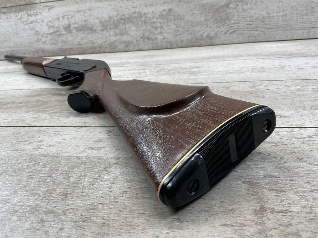 Handgun replica with wooden grip, commonly associated with Cold War memorabilia and security at Checkpoint Charlie in Berlin. Ideal for collectors interested in historic Berlin border crossing artifacts.