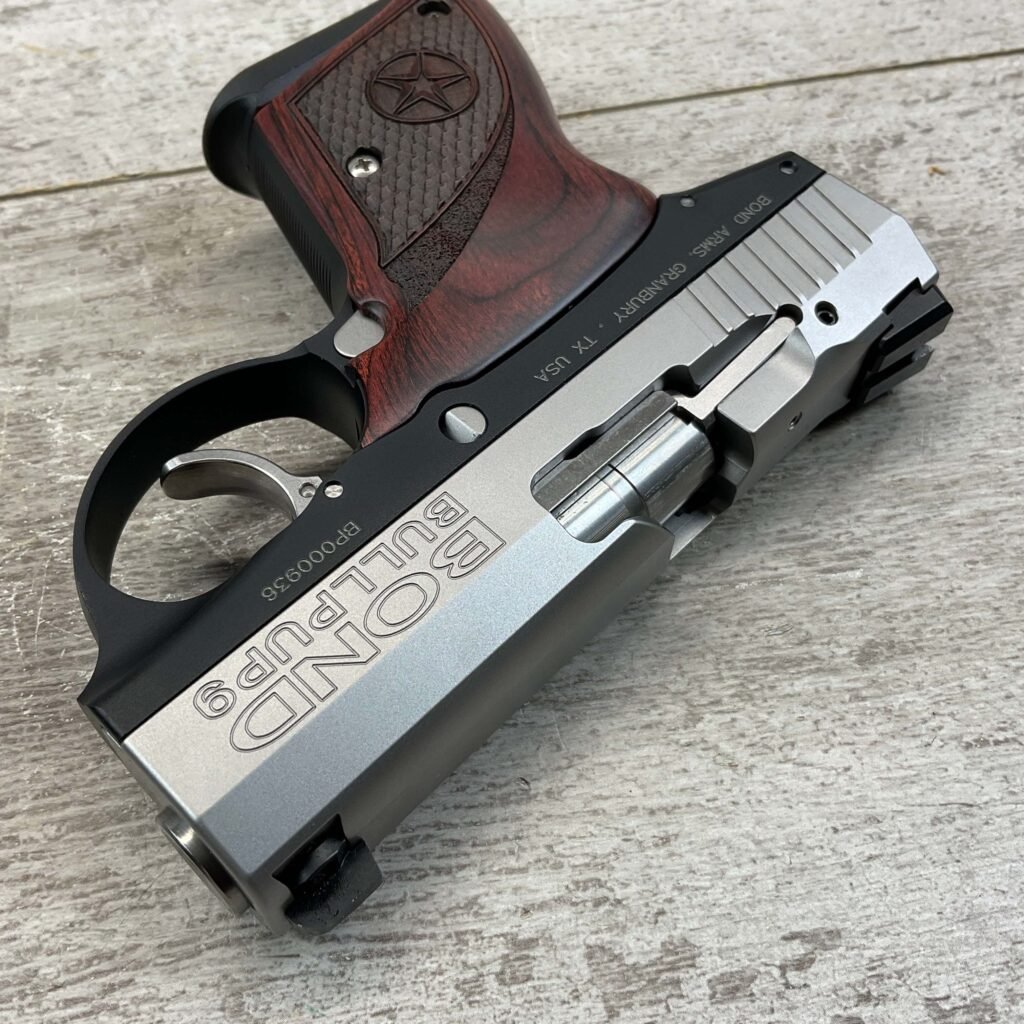 9mm handgun with stainless steel slide and wooden grip, displayed on wooden surface, associated with firearm collection and shooting sports.