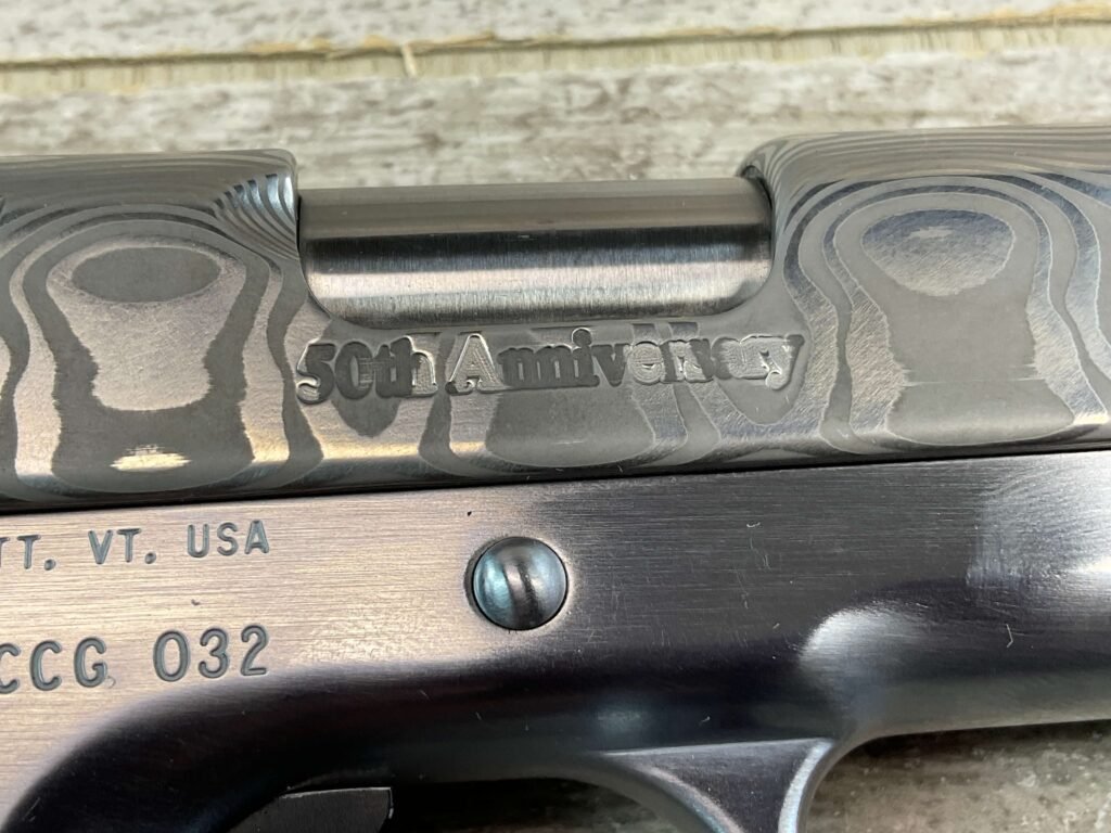 CLARK CUSTOM 50TH ANNIVERSARY MILLENNIUM MELTDOWN .45ACP SEMI AUTO PISTOL, JAMES EARL JONES COLLECTION #5-10768