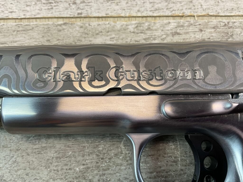 CLARK CUSTOM 50TH ANNIVERSARY MILLENNIUM MELTDOWN .45ACP SEMI AUTO PISTOL, JAMES EARL JONES COLLECTION #5-10768