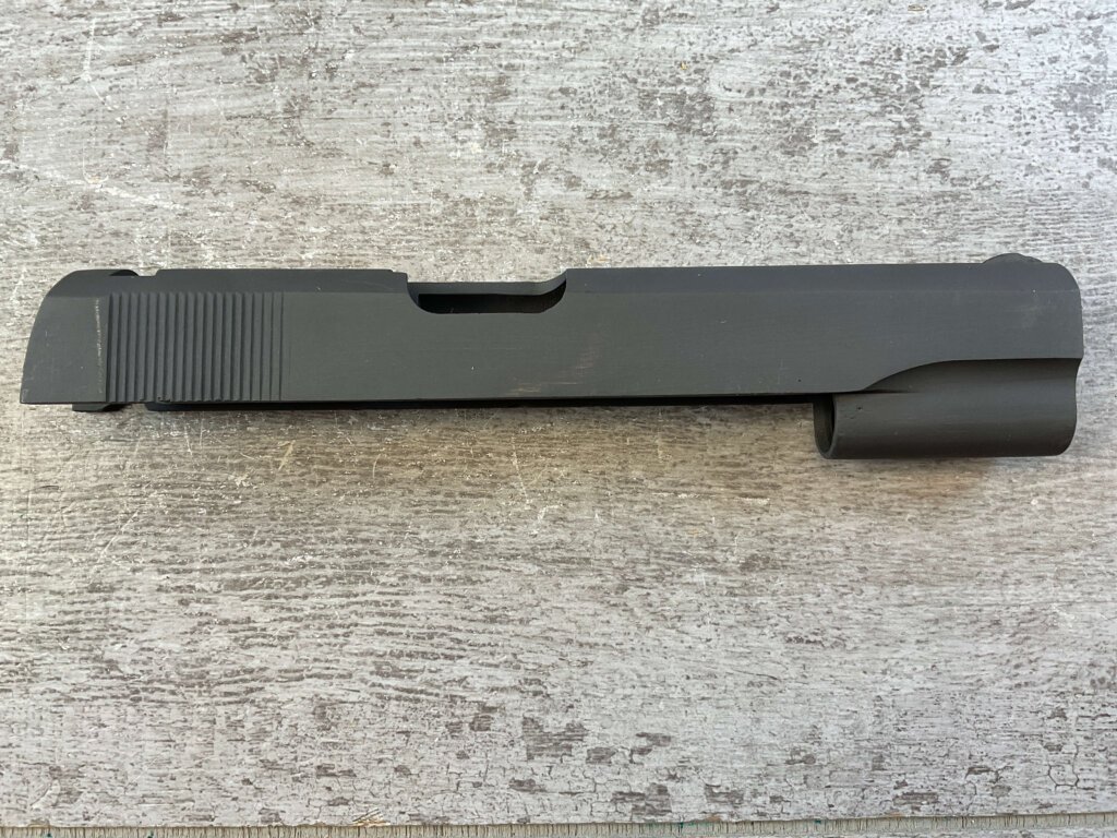 BLANK PARKERIZED 1911 SLIDE ONLY W/FRONT SIGHT, JAMES EARL JONES COLLECTION #5-11682BLANK PARKERIZED 1911 SLIDE ONLY W/FRONT SIGHT, JAMES EARL JONES COLLECTION #5-11682