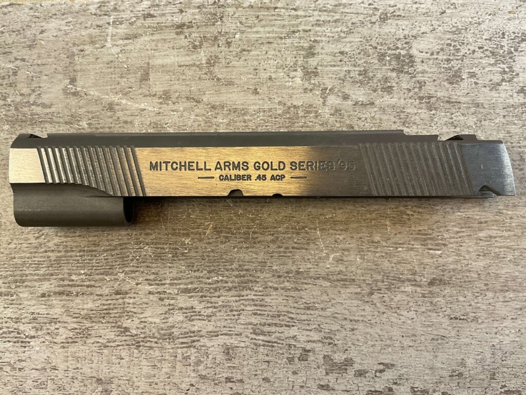 MITCHELL ARMS GOLD SERIES'95, SLIDE, JAMES EARL JONES COLLECTION #5-11694