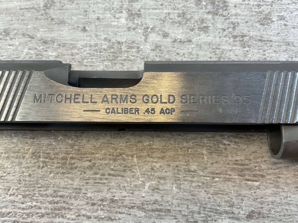 MITCHELL ARMS GOLD SERIES'95, SLIDE, JAMES EARL JONES COLLECTION