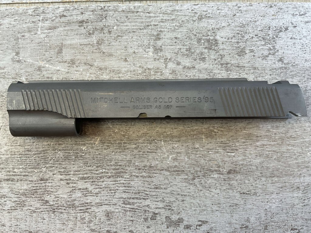 MITCHELL ARMS GOLD SERIES'95, SLIDE, JAMES EARL JONES COLLECTION #5-11695