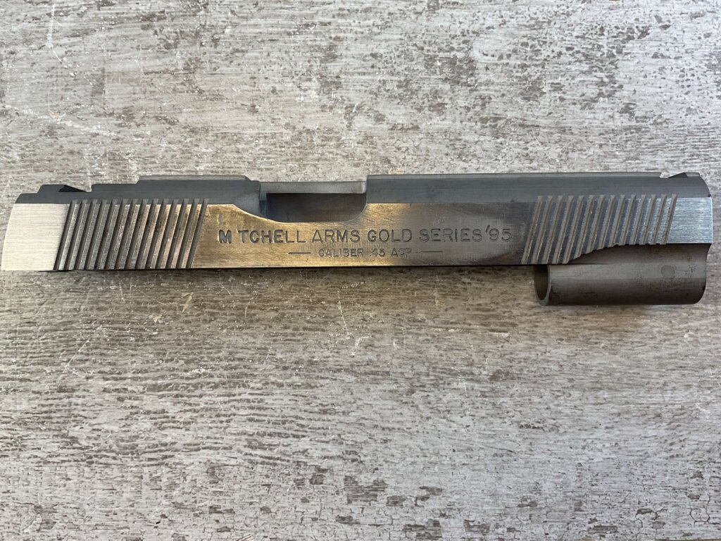 MITCHELL ARMS GOLD SERIES'95, SLIDE, JAMES EARL JONES COLLECTION #5-11695