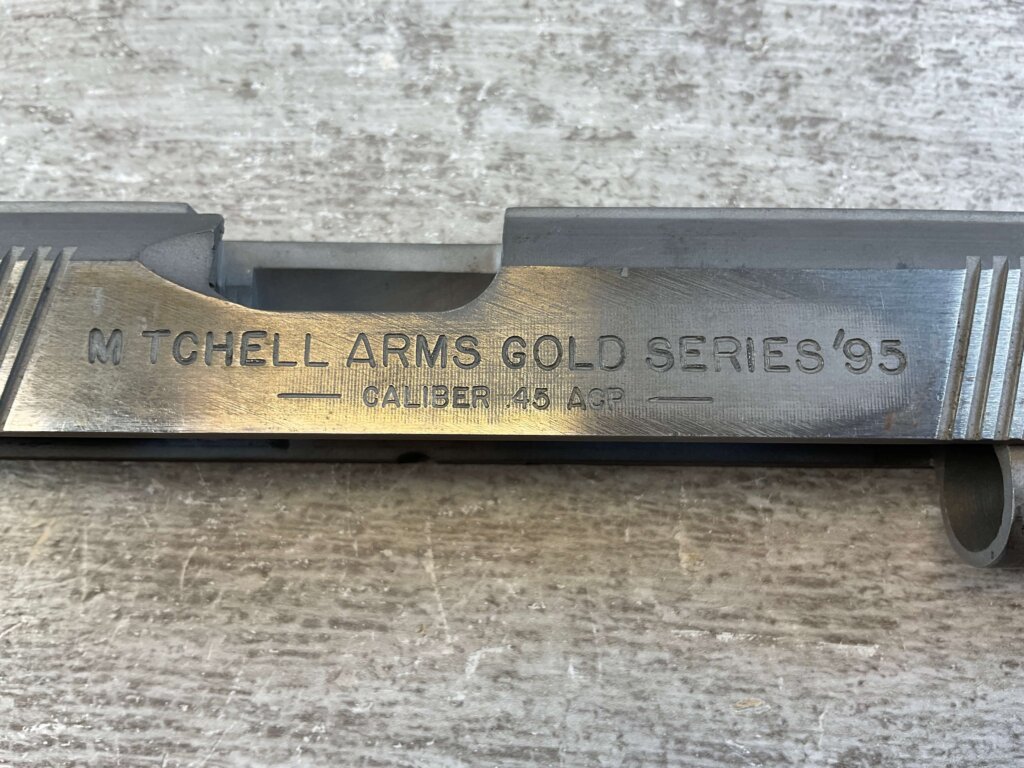 MITCHELL ARMS GOLD SERIES'95, SLIDE, JAMES EARL JONES COLLECTION #5-11695